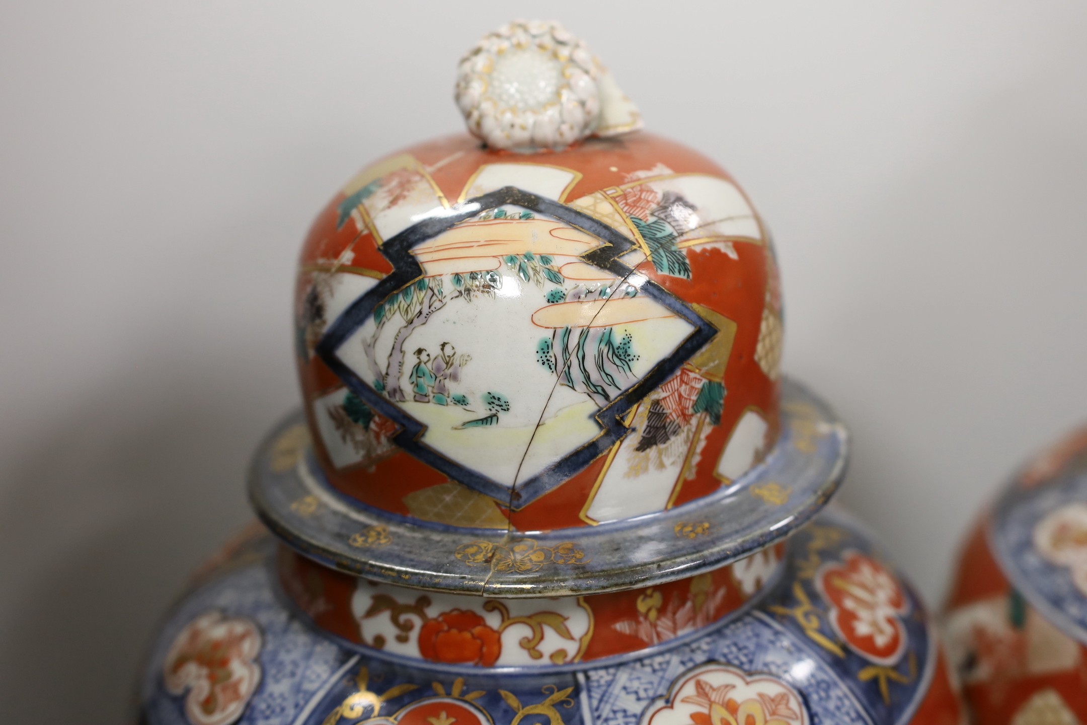 A pair of Imari vases and covers. 39cm high